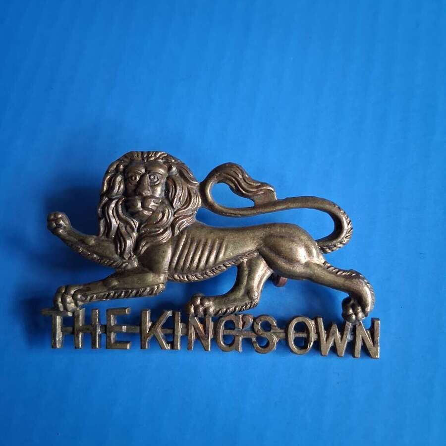 The kings own cap badge