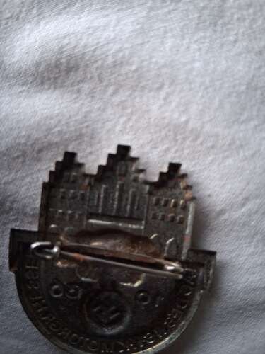 Third Reich day badge priced due to condition