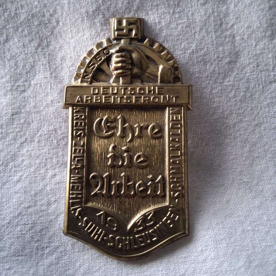Third Reich day badge priced due to condition